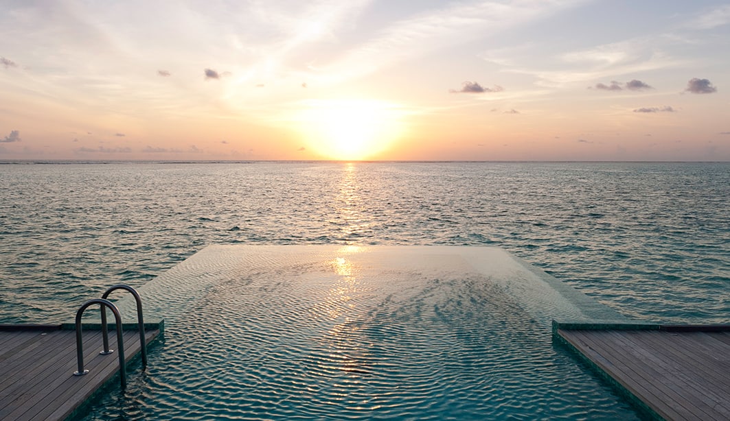 sunset-water-villa-pool-1063x614