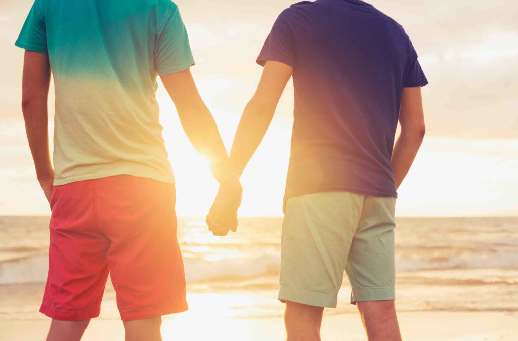 Gay Couple on Beach at Sunset
