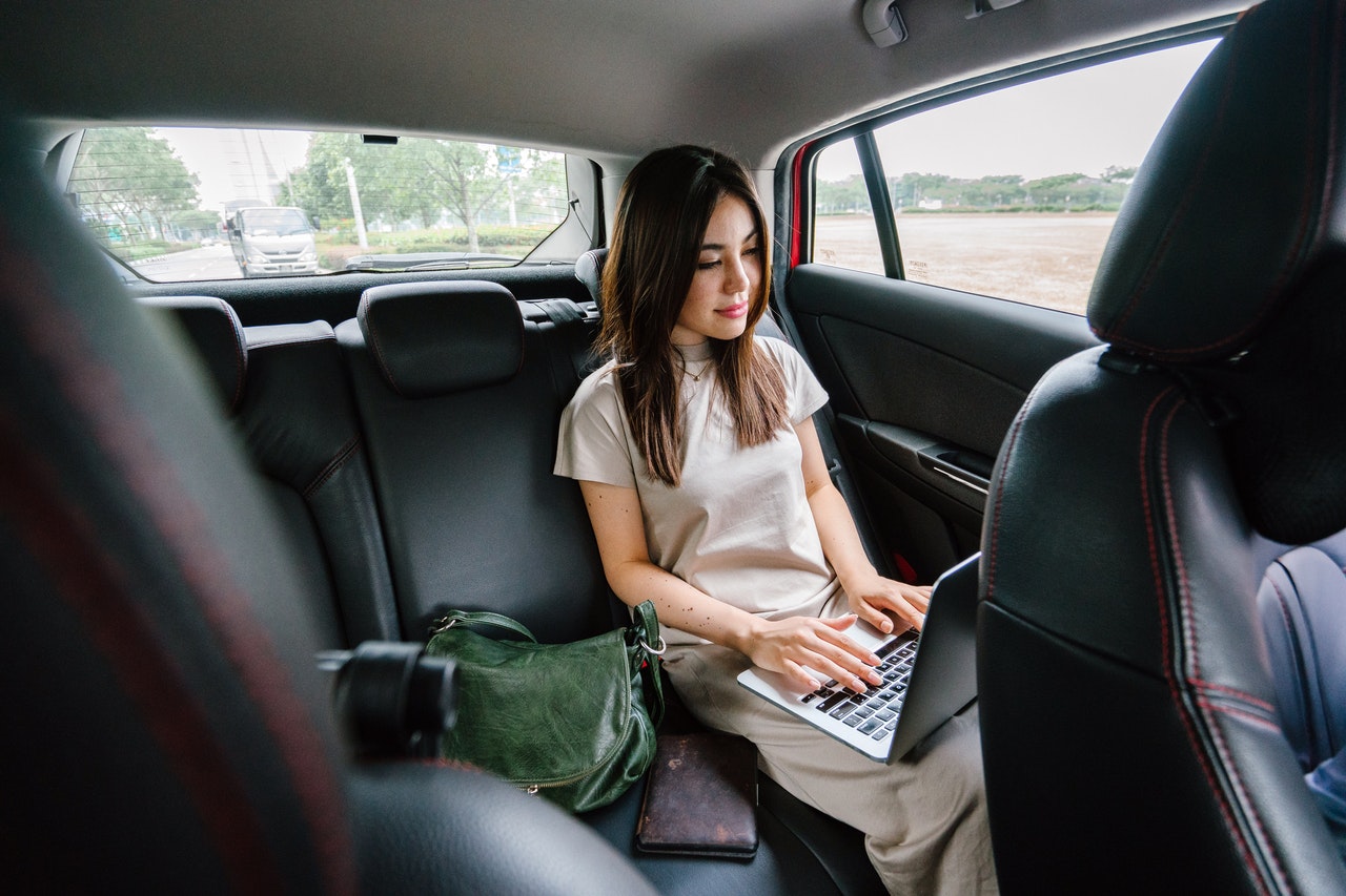 Business Woman Travelling in Car